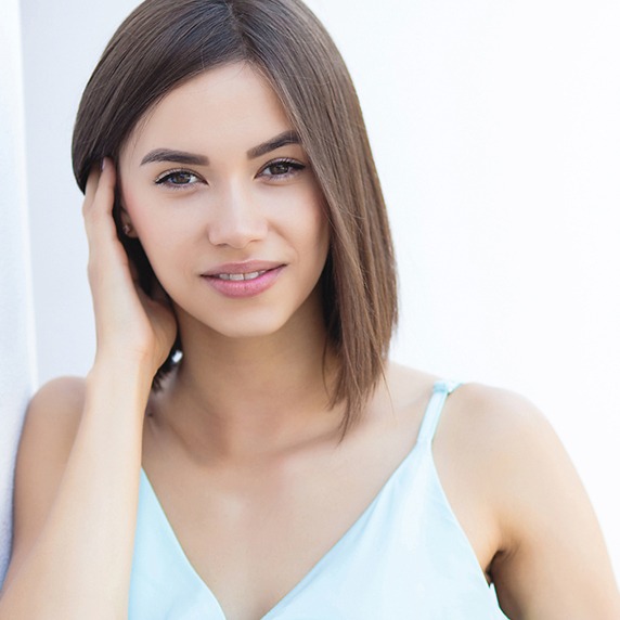 brunette woman with light blue dress