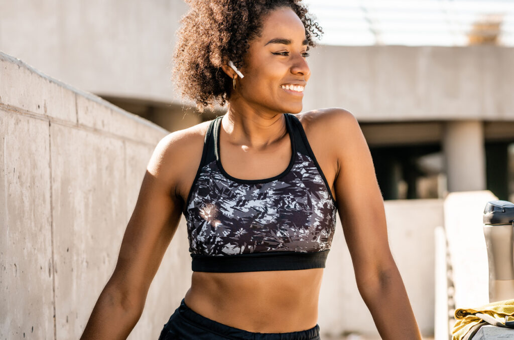 Athlete woman relaxing after work out outdoors.