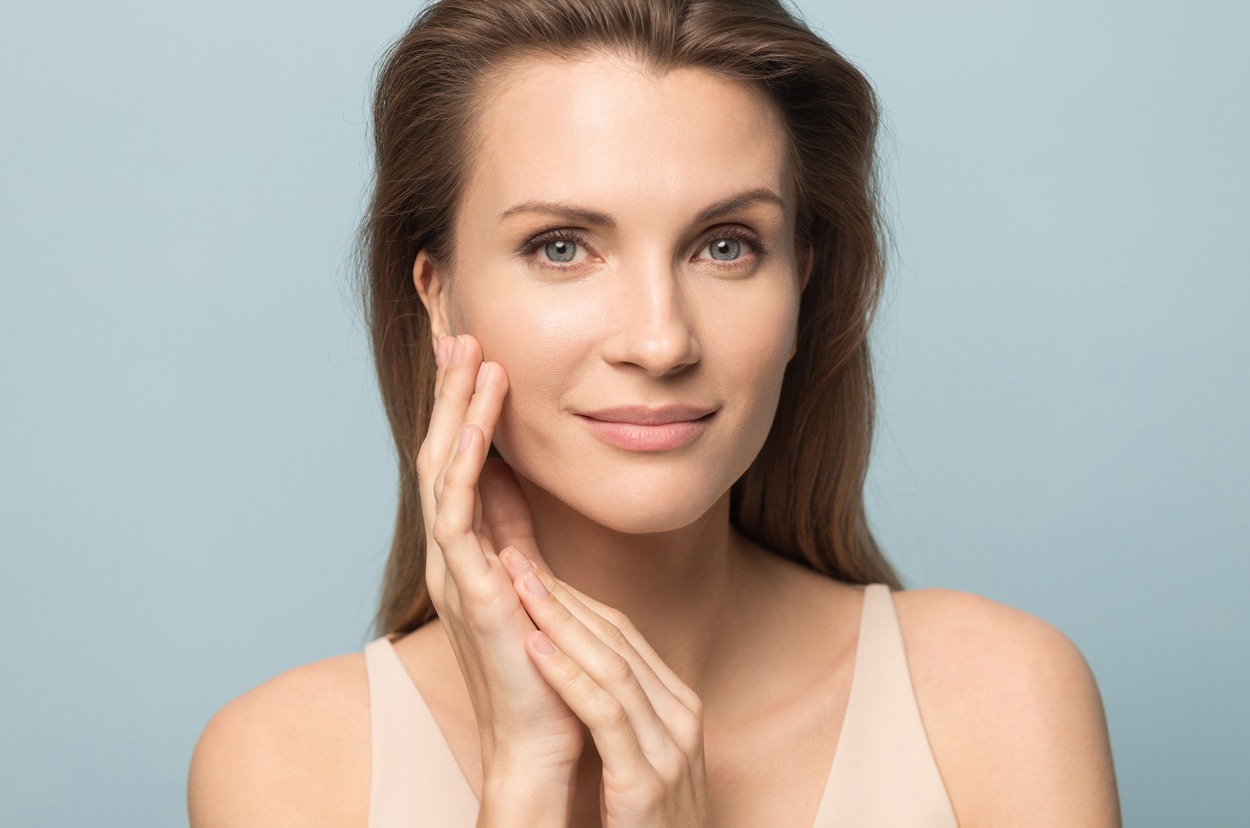 Portrait of beautiful woman touch healthy clean skin