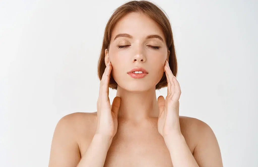 Woman with eyes closed, serene expression.